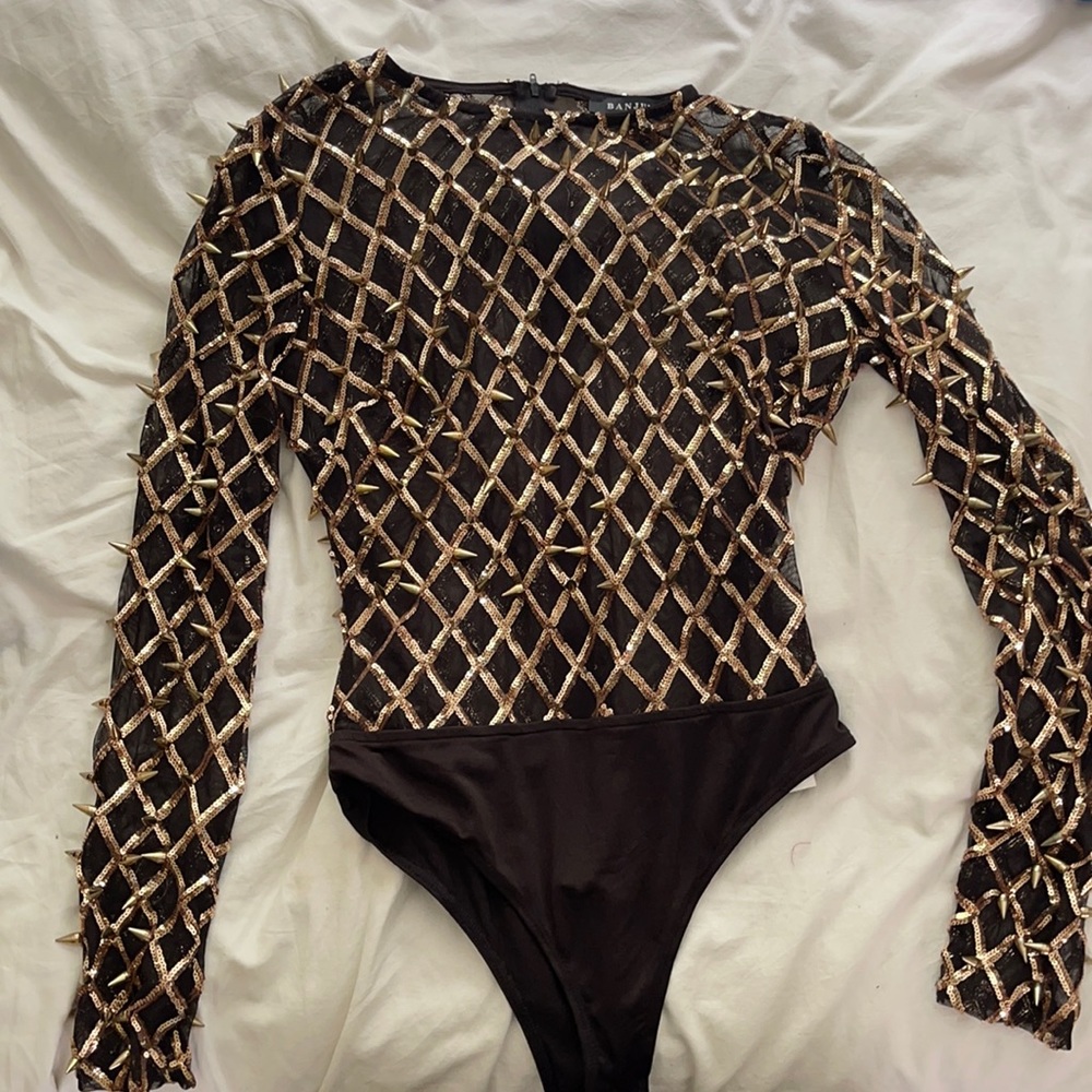 Custom designed gold-studded bodysuit.